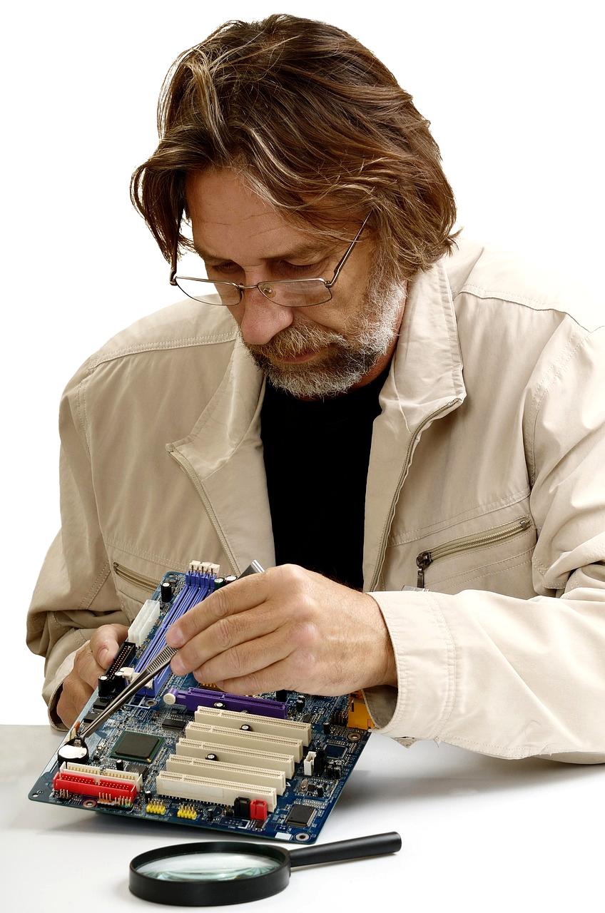 Technician performing initial computer assessment