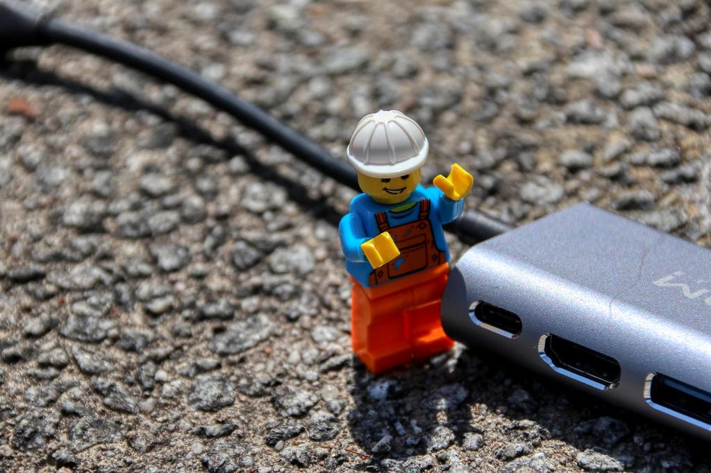 Computer technician providing services on laptop